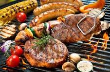 Food on a grill with vegetables